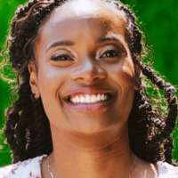 Brooklyn Payne smiling against a green background